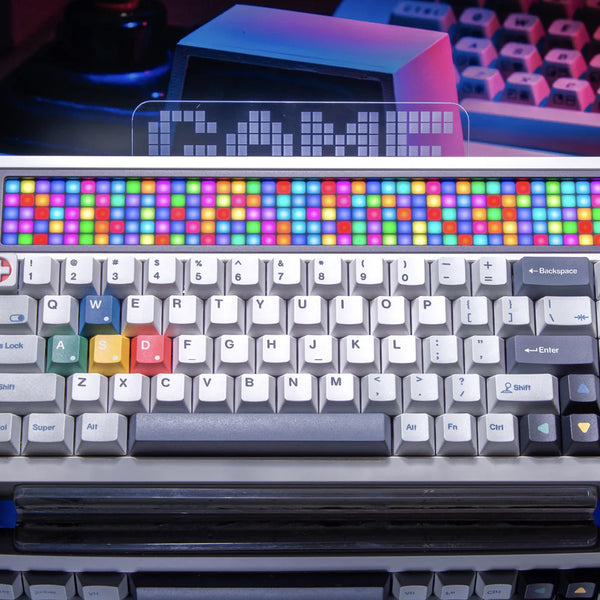 Colorful keyboard with LED backlit keys on a reflective surface