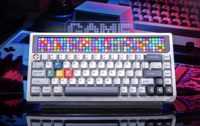 Colorful keyboard with LED backlit keys on a reflective surface